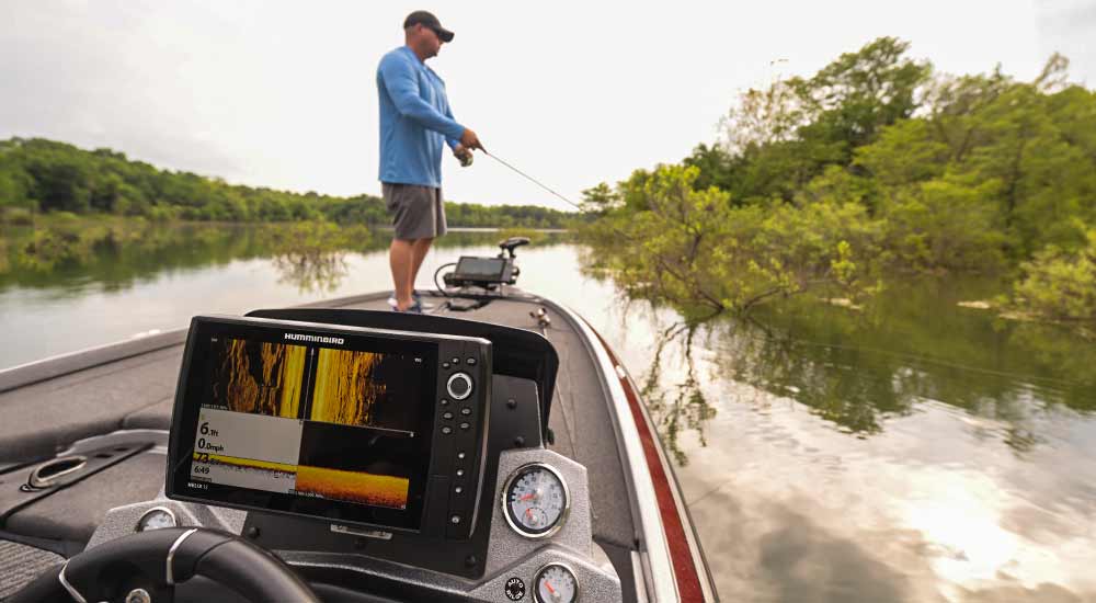 Man Fishing With Best Fishing Finder on a boat