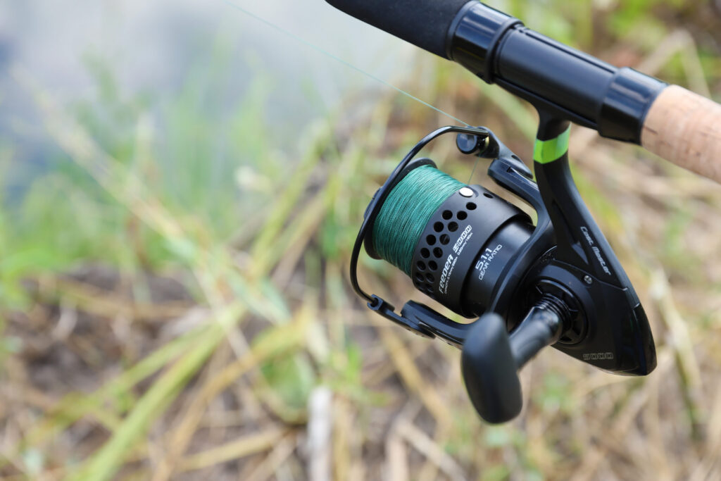 A spinning reel spooled with the best monofilament fishing line for strength and smooth casting.