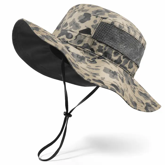 Beige and charcoal camouflage wide-brim outdoor fishing hat with mesh side panels and adjustable chin strap on white background